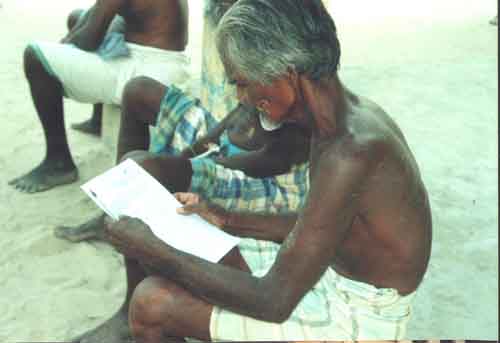 Devotee reading Pada Yatra notice